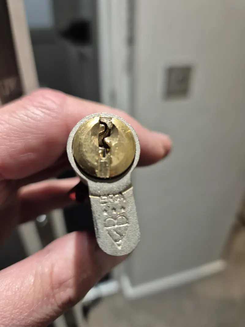 Broken key being extracted from a door lock before the cylinder was damaged further
